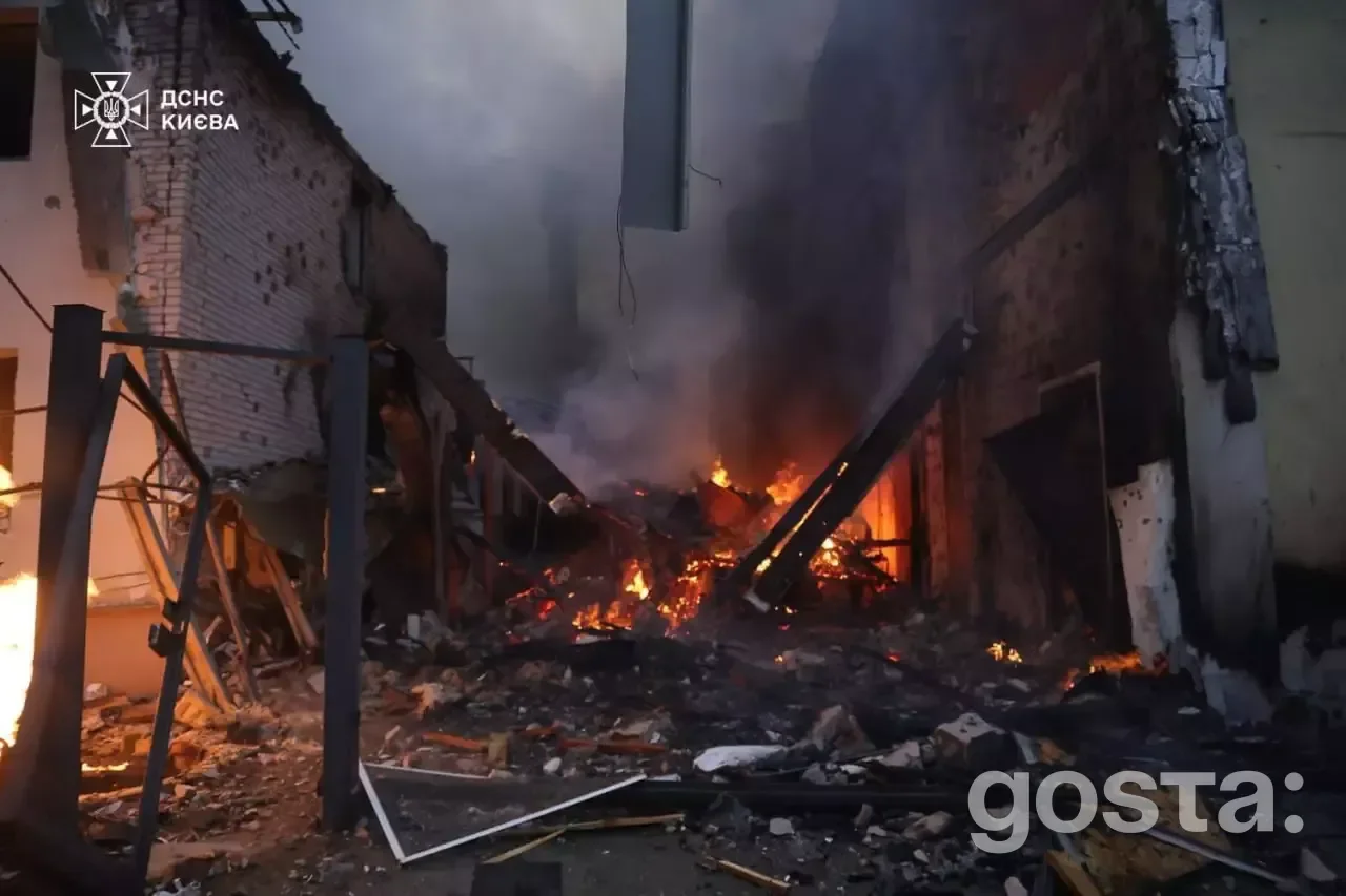 Devastation from a Russian attack in Ukraine; first responders tackle fires and debris in a damaged building.