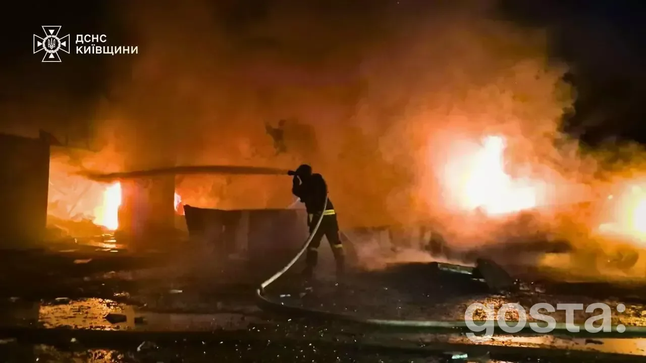 Emergency responders extinguish fires after a Russian missile attack in Kyiv, highlighting the ongoing crisis in Ukraine