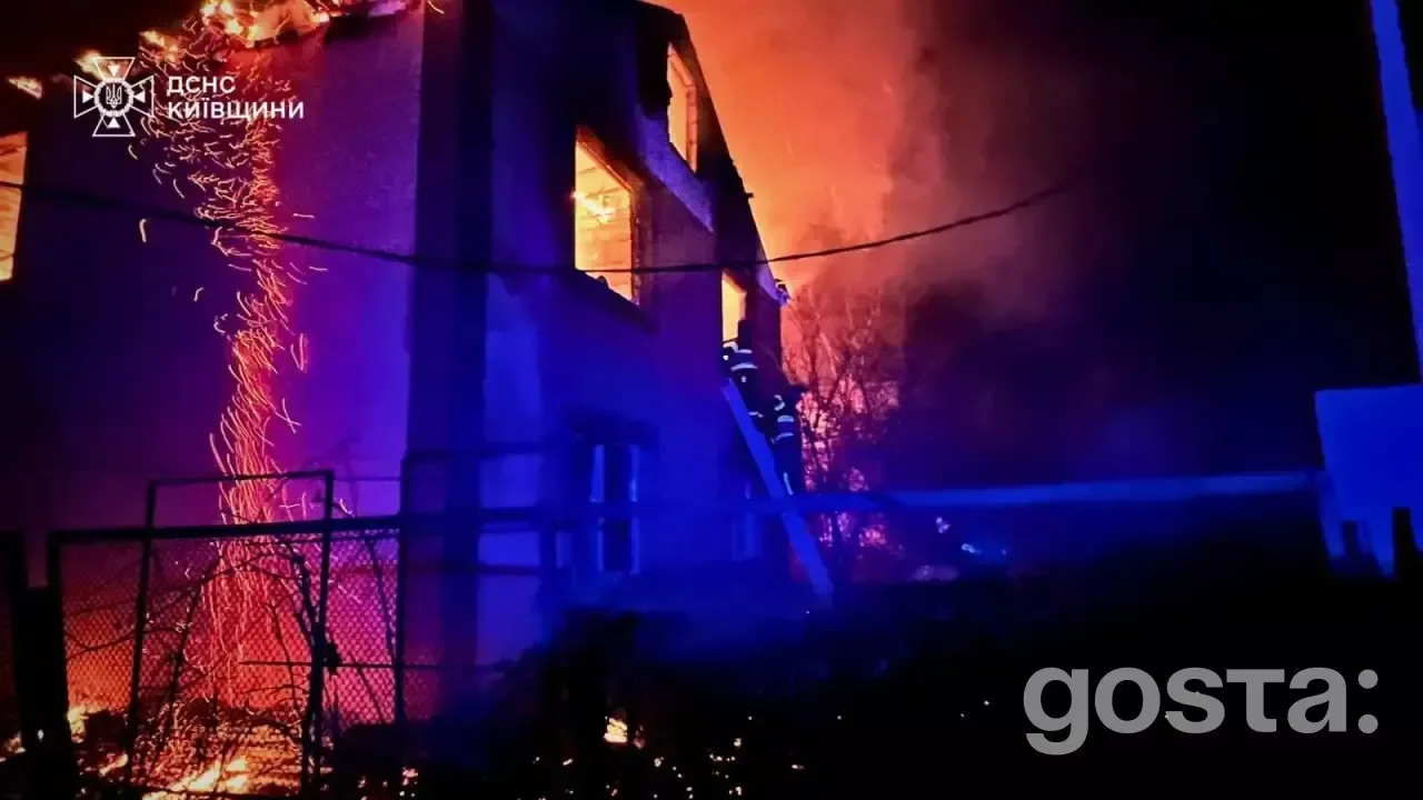 Emergency responders tackle fires in Kyiv following a massive Russian attack, documenting damage and evacuating resident
