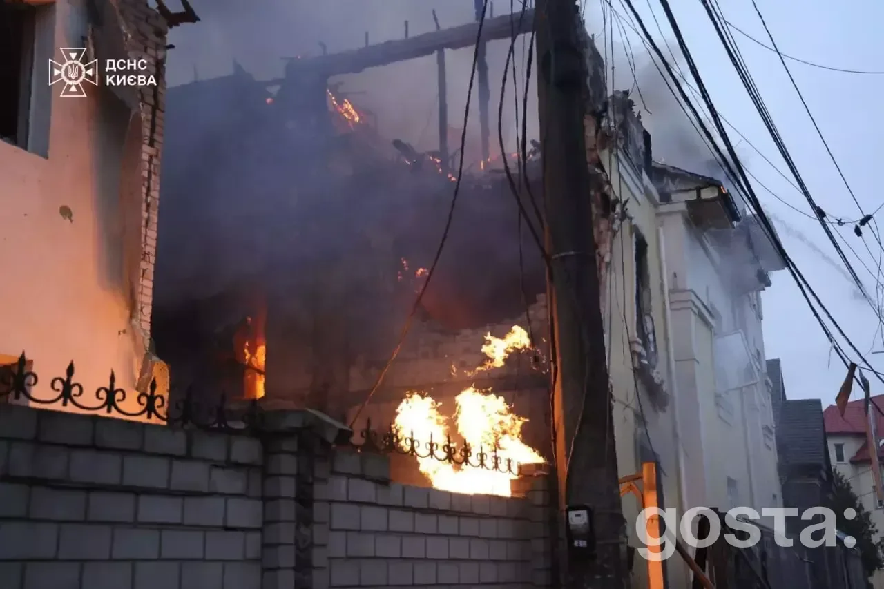 Emergency responders tackle flames from a building hit during a Russian attack in Kyiv, highlighting the devastating aft