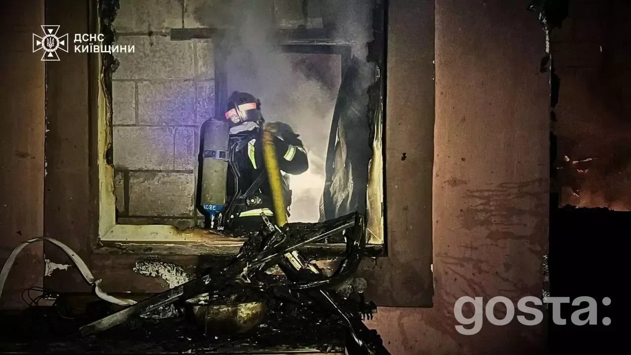 Firefighter extinguishing flames inside a charred building after a devastating attack in Kyiv, Ukraine, on 27.12.2025.