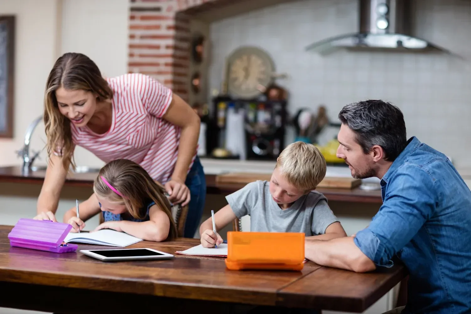Parents studying and learning together with their children at home