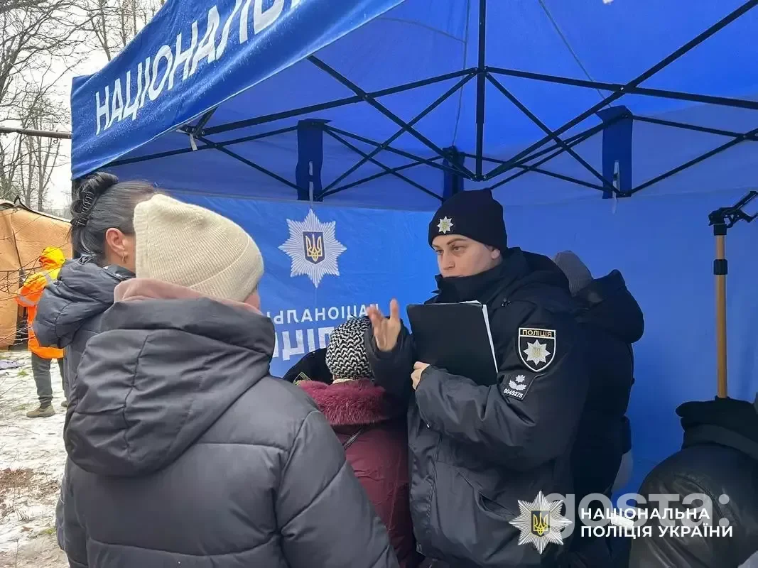 Rescue workers assist civilians in Dnipro following a nighttime attack, providing support and assessing damage.