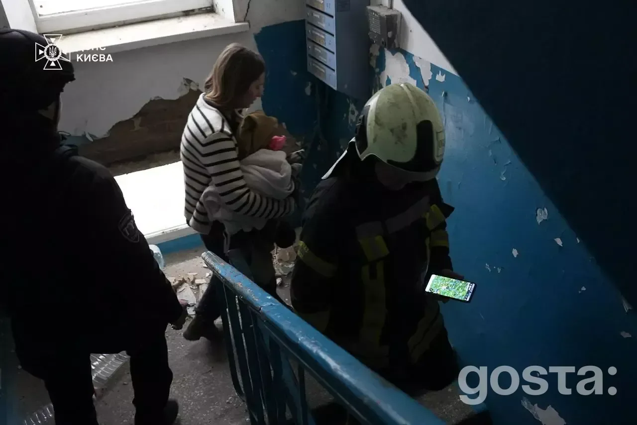 Rescue workers evacuate residents after Russian attacks in Kyiv, assisting families and addressing urgent fire hazards.