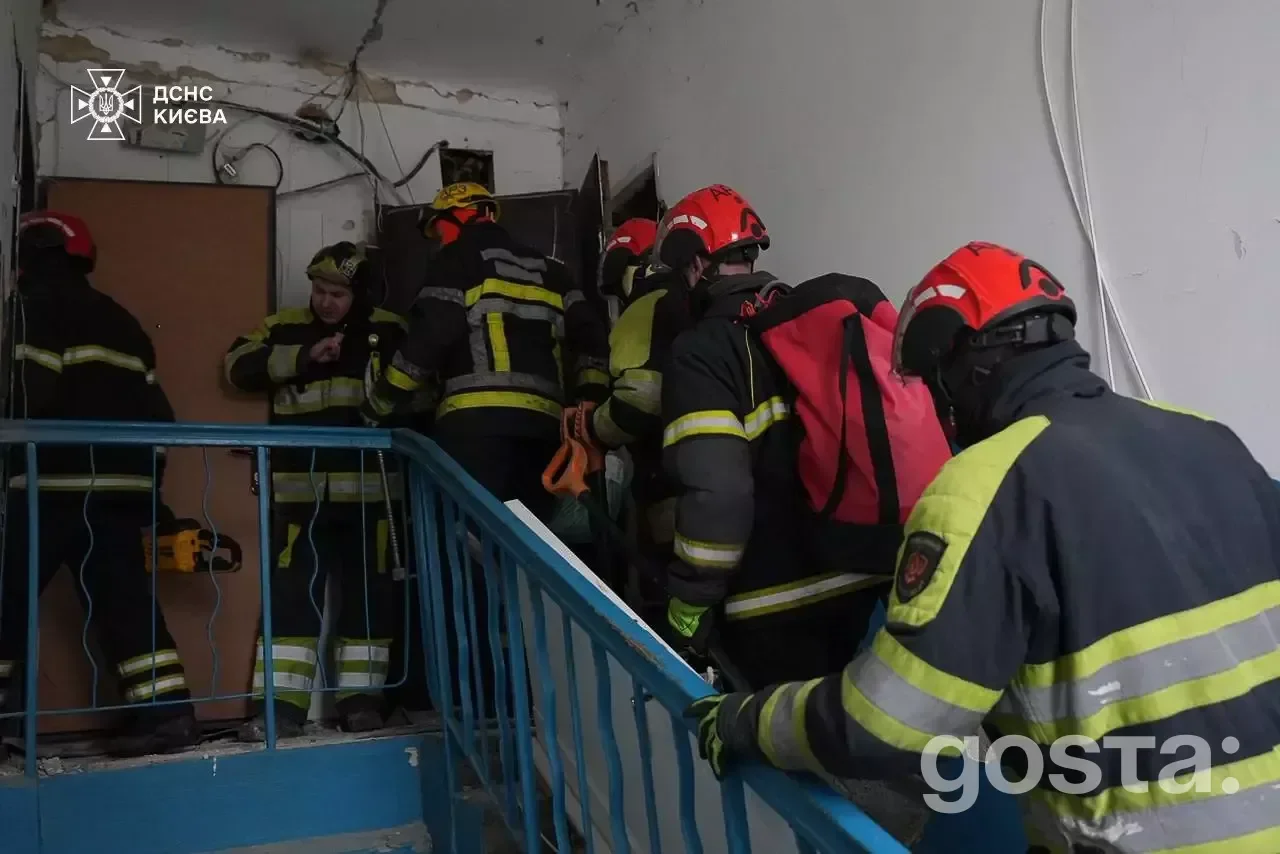 Rescue workers from Ukraine's emergency services operate in a damaged building following a massive Russian attack in Kyi