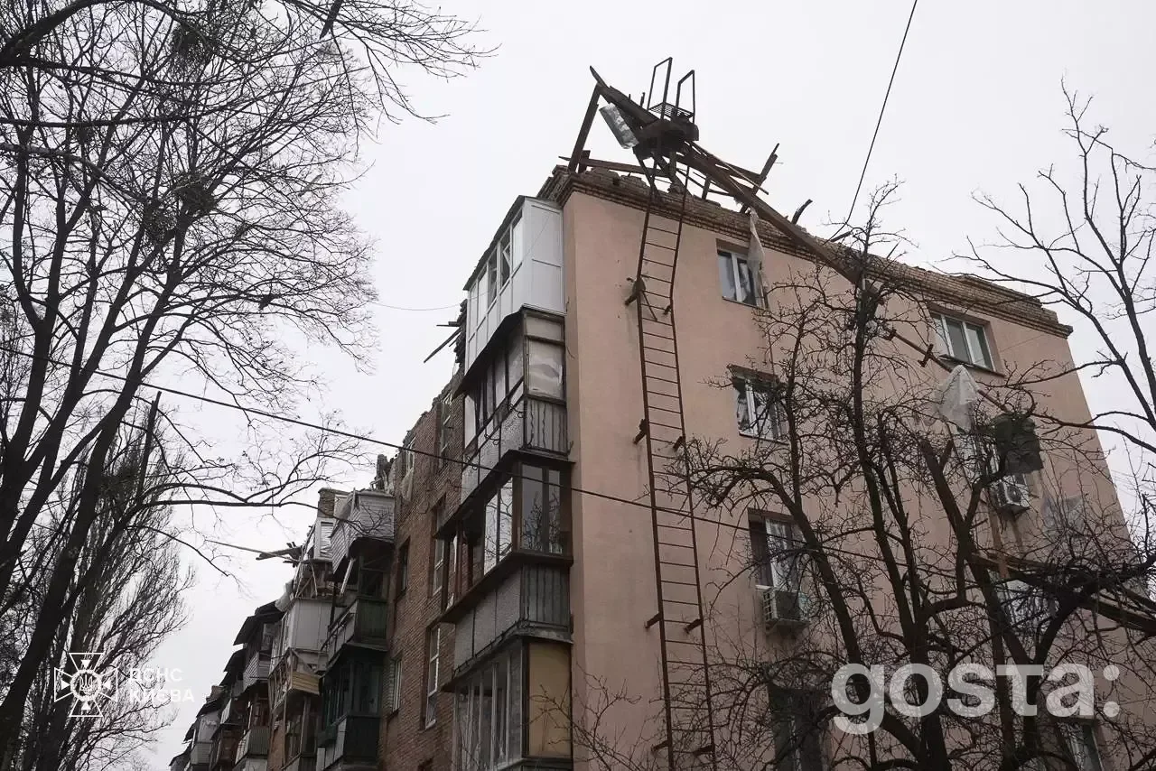 Ruined building in Kyiv after Russian attacks; emergency services respond to fires and document damage.